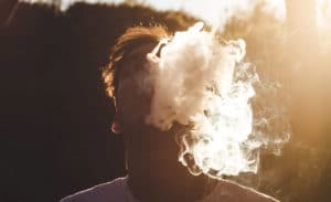 Man Vaping with smoke surrounding