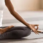 Woman sitting in yoga pose