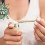 women lighting cannabis joint